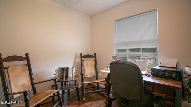 office space with wood finished floors