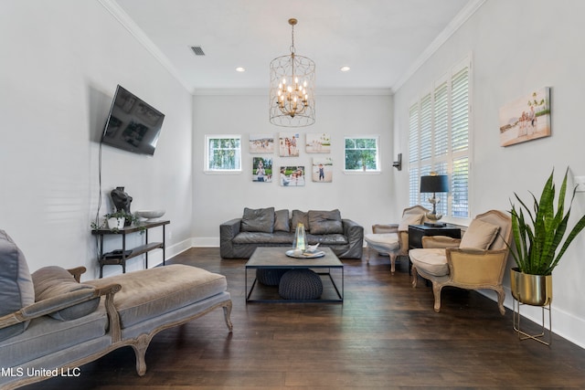 living room with a notable chandelier, dark hardwood / wood-style floors, and ornamental molding