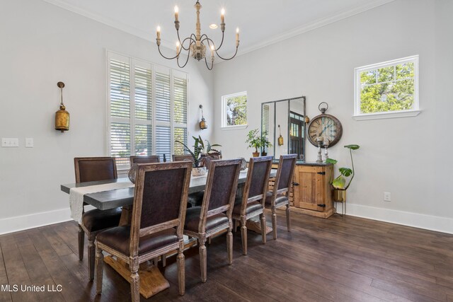 dining area with dark hardwood / wood-style flooring, plenty of natural light, and ornamental molding