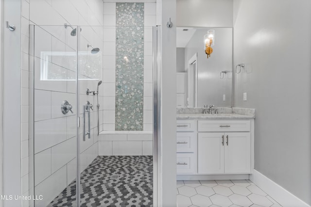 bathroom with tile patterned flooring, vanity, and an enclosed shower