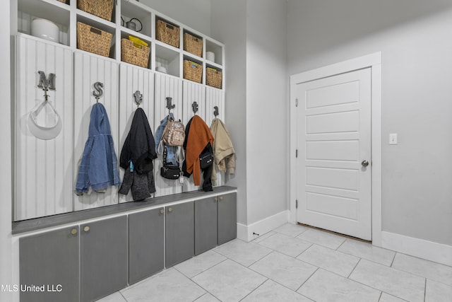 mudroom with light tile patterned flooring