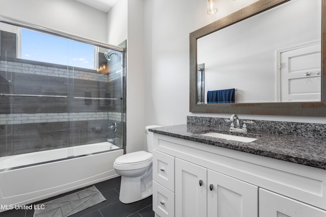 full bathroom with tile patterned flooring, vanity, toilet, and enclosed tub / shower combo