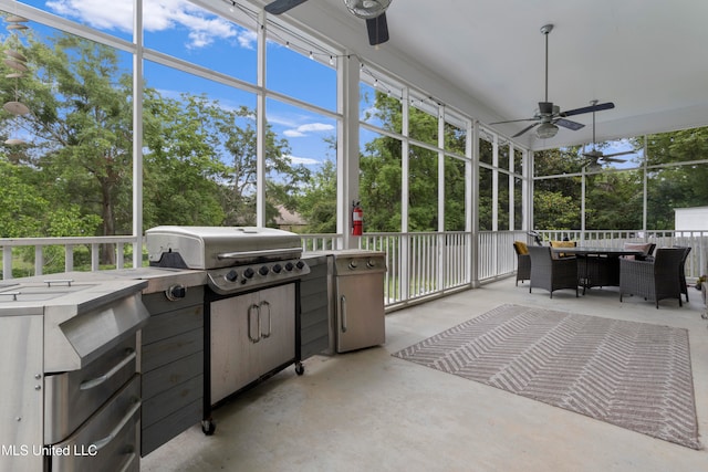 unfurnished sunroom featuring ceiling fan