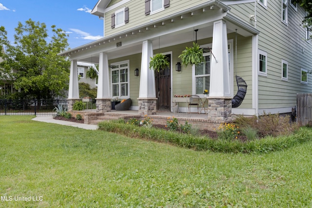 view of front of property with a porch and a front lawn