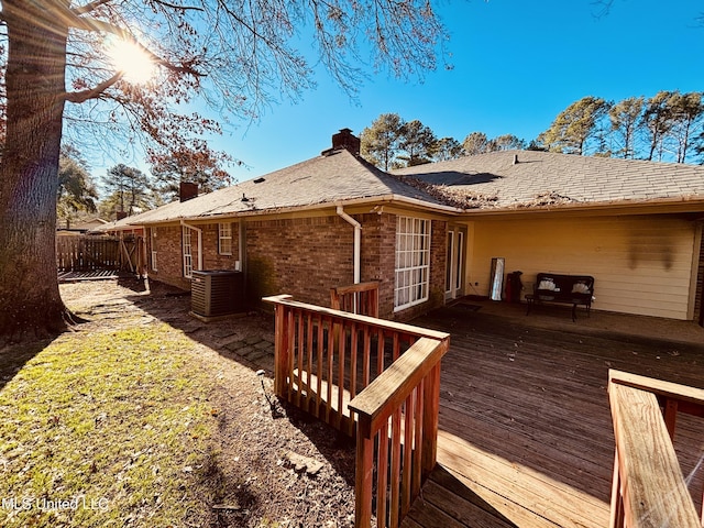 back of house featuring a deck and cooling unit