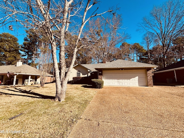 view of front facade with a front yard and a garage