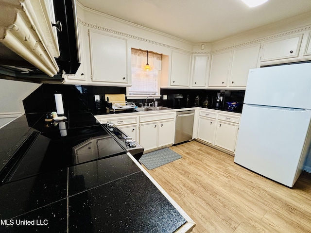 kitchen featuring stainless steel dishwasher, white cabinets, sink, light hardwood / wood-style flooring, and white refrigerator