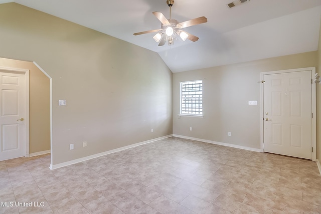 spare room with ceiling fan and vaulted ceiling