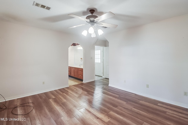 spare room featuring ceiling fan and light wood-type flooring