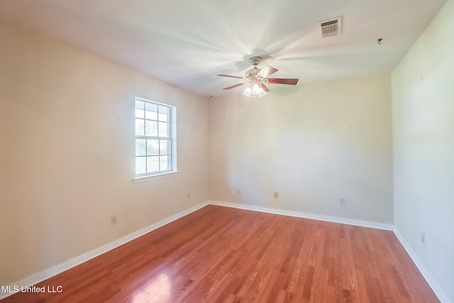 unfurnished room with ceiling fan and light hardwood / wood-style floors