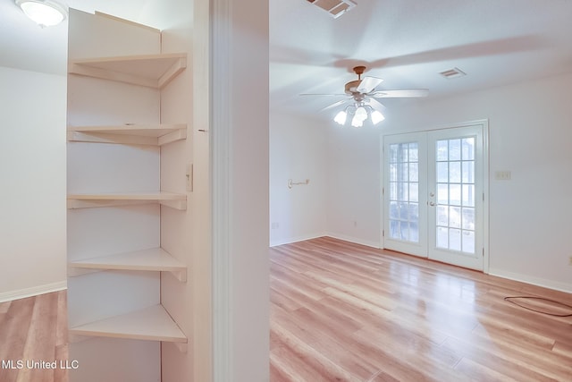 interior space featuring light hardwood / wood-style floors, french doors, and ceiling fan