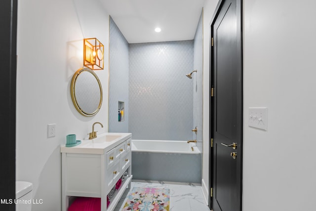 bathroom with toilet, a bathing tub, marble finish floor, vanity, and recessed lighting