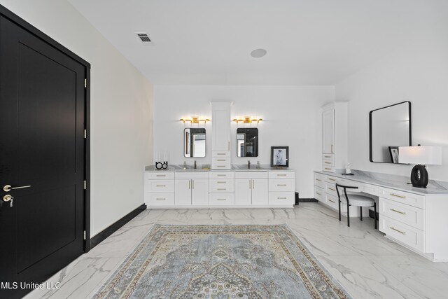 bathroom with marble finish floor, visible vents, baseboards, and vanity