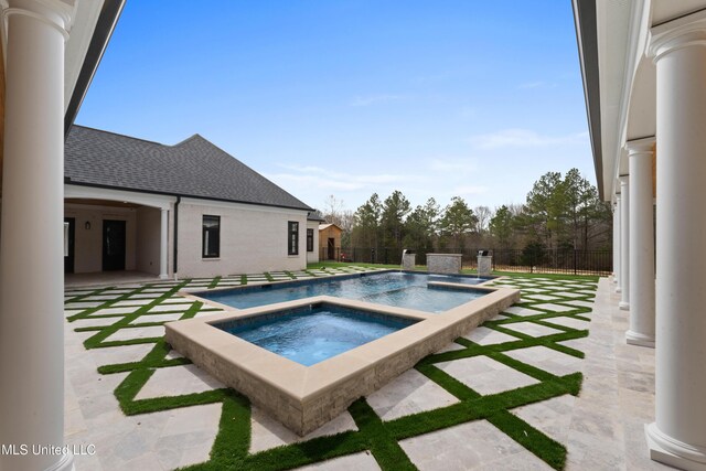 view of pool featuring a fenced backyard, a patio, a fenced in pool, and an in ground hot tub