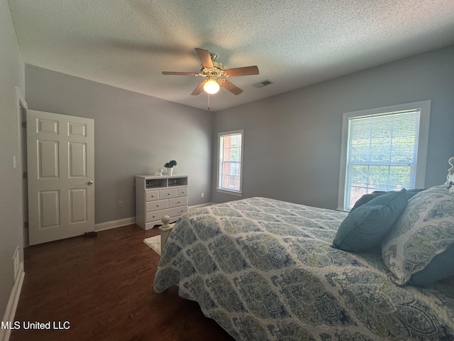 2610 Dickens Place Dr, Southaven, MS 38671 - bedroom featuring dark wood-type flooring, a textured ceiling, and ceiling fan