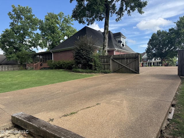 2610 Dickens Place Dr, Southaven, MS 38671 - view of property exterior featuring a gate and brick siding