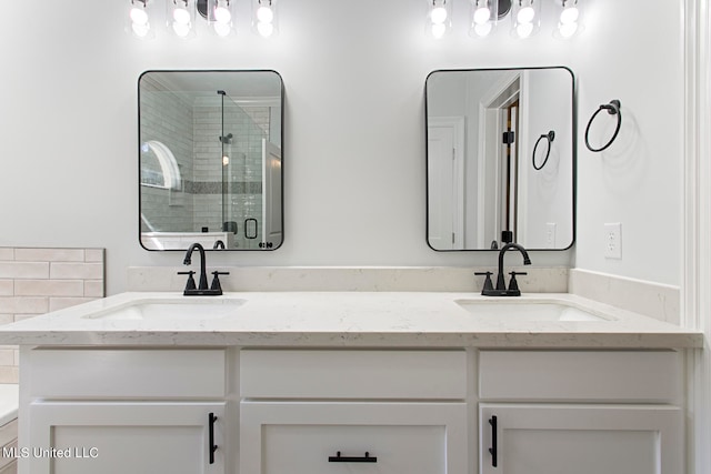 bathroom featuring vanity and walk in shower