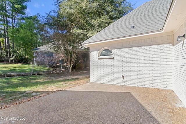 exterior space featuring a yard and a patio area