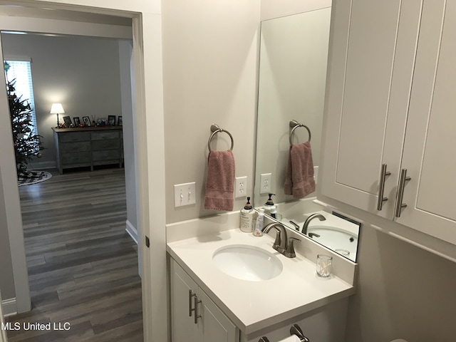 bathroom with vanity and hardwood / wood-style flooring