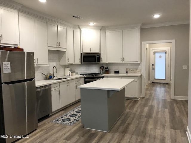 kitchen featuring white cabinetry, sink, and appliances with stainless steel finishes