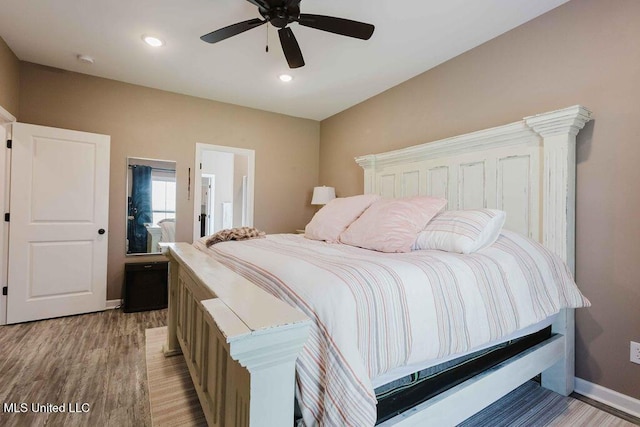 bedroom featuring ceiling fan and light hardwood / wood-style floors