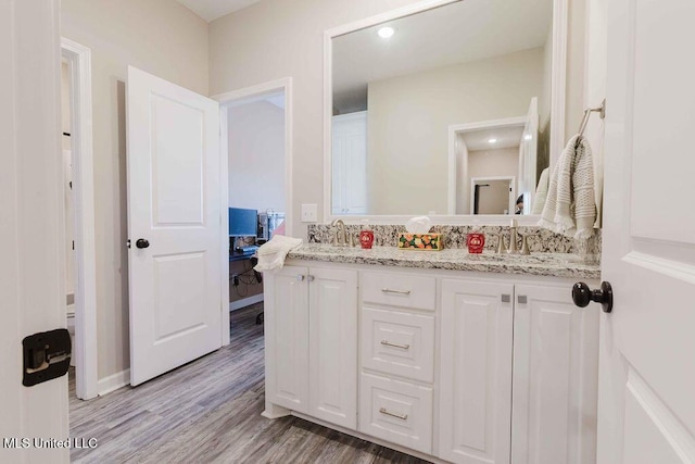 bathroom featuring vanity and hardwood / wood-style flooring