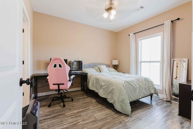 bedroom featuring hardwood / wood-style floors and ceiling fan