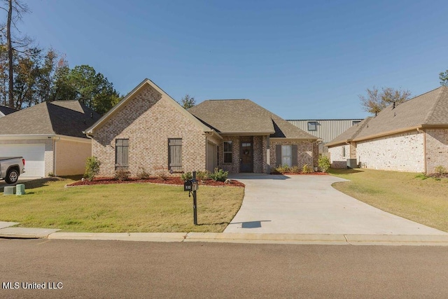 view of front facade featuring a front lawn and a garage