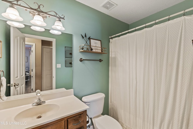 full bath with toilet, a textured ceiling, vanity, and visible vents