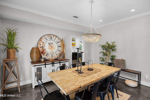 dining room with a notable chandelier and ornamental molding