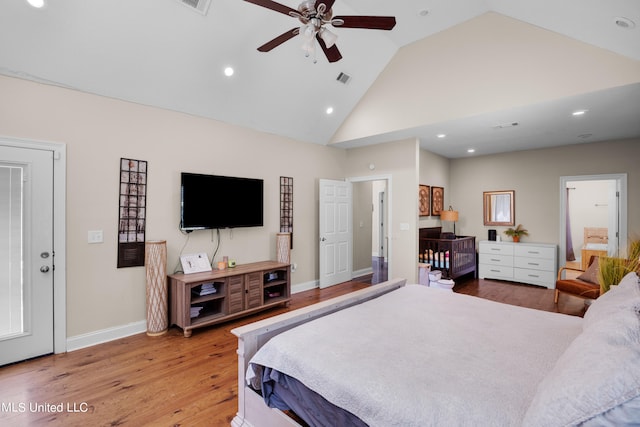 bedroom featuring hardwood / wood-style flooring, high vaulted ceiling, and ceiling fan