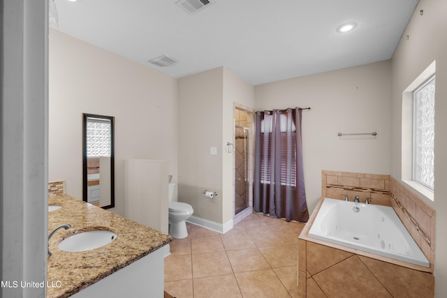 full bathroom featuring vanity, tile patterned floors, plus walk in shower, and toilet