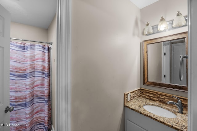 bathroom with vanity and curtained shower