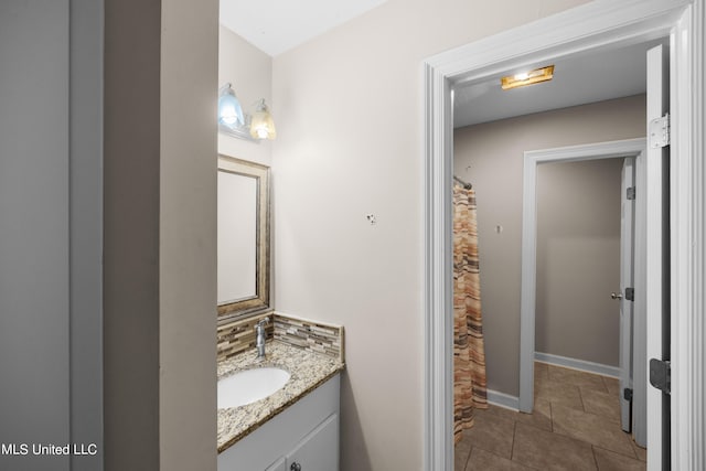 bathroom featuring vanity, a shower with curtain, and tile patterned floors