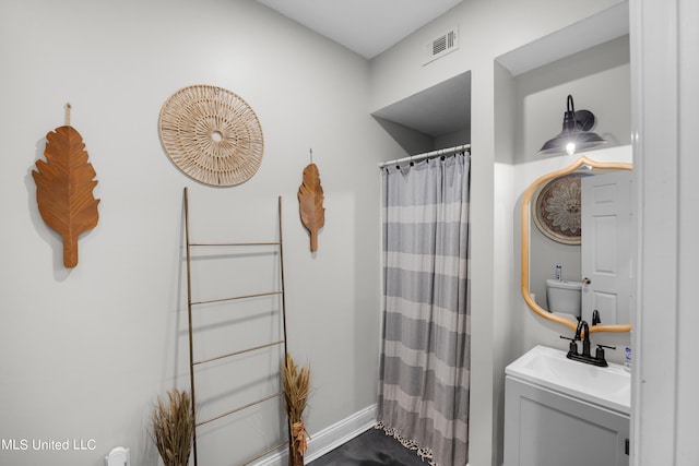 bathroom with vanity and a shower with shower curtain