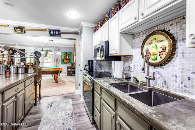 kitchen with white cabinets, sink, light wood-type flooring, pool table, and stainless steel appliances