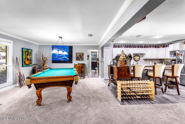 rec room featuring light colored carpet, ornamental molding, and pool table