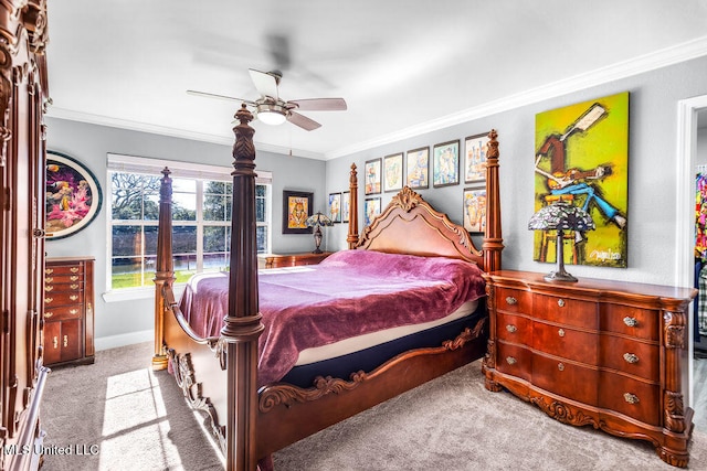 carpeted bedroom featuring ceiling fan and ornamental molding