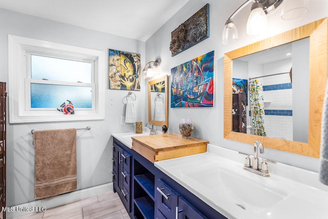 bathroom featuring a shower with curtain and vanity