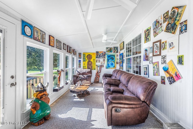 sunroom featuring ceiling fan and vaulted ceiling