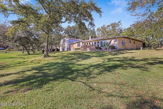 exterior space with a wooden deck and a front yard