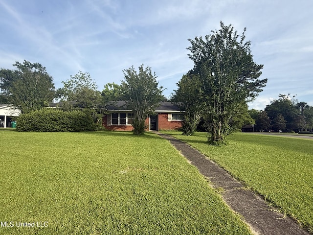 15449 Mimosa Dr, Gulfport, MS 39503 - view of front of home with a front yard and brick siding