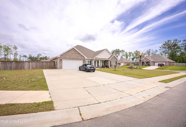 view of front of house with driveway, fence, an attached garage, and a front lawn