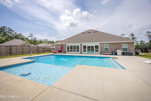 view of swimming pool featuring a fenced backyard, a patio, and a fenced in pool