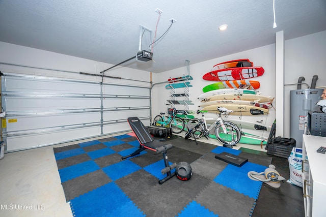 garage with a garage door opener and electric water heater