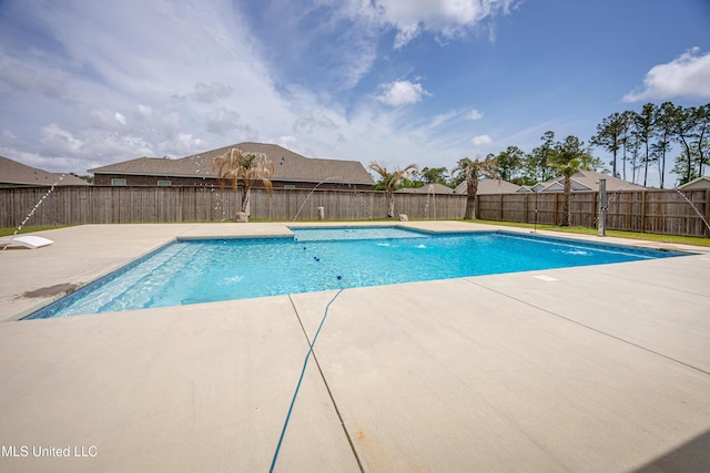 view of pool featuring a patio and a fenced backyard