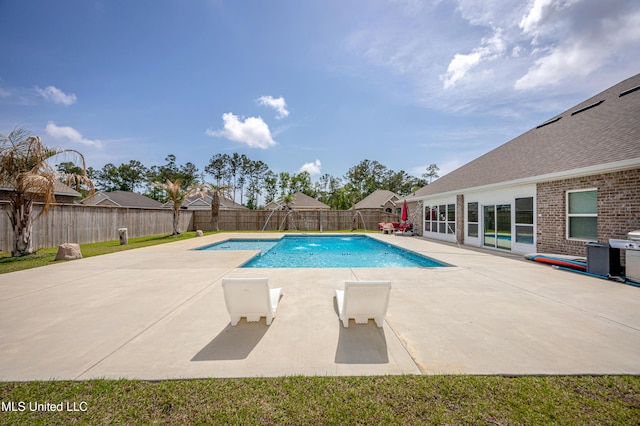 view of swimming pool with a fenced in pool, a patio area, and a fenced backyard