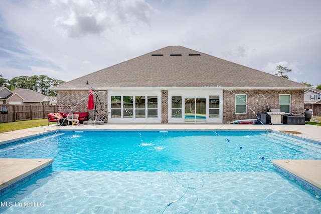 view of pool featuring fence, a patio area, outdoor lounge area, and a fenced in pool