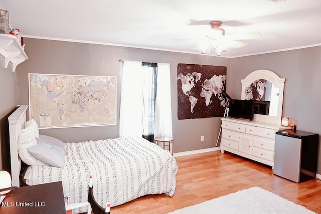 2208 Highland Dr, Gautier, MS 39553 - bedroom featuring light wood finished floors, baseboards, ornamental molding, fridge, and ceiling fan