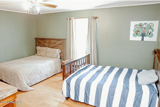 2208 Highland Dr, Gautier, MS 39553 - bedroom with crown molding, wood finished floors, and ceiling fan